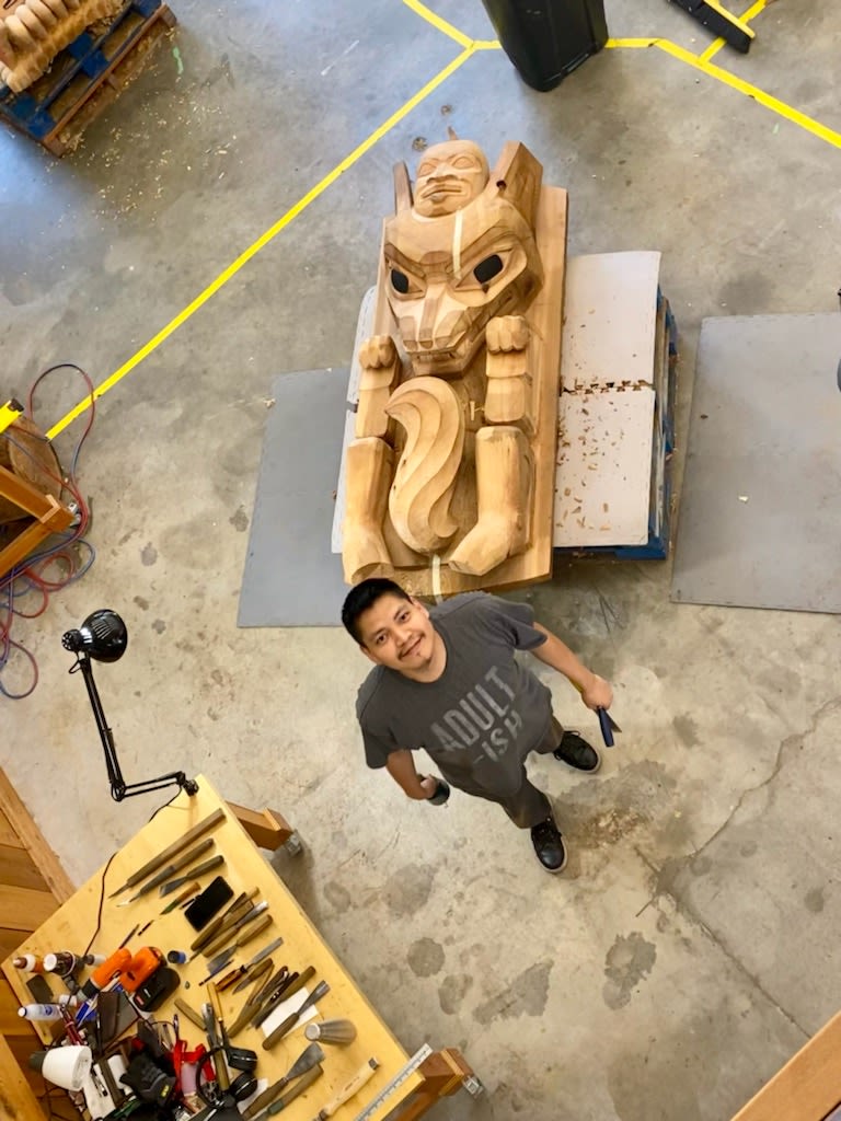 Darryl Moore is an indigenous artist and a member of the Outdoor Artist Collective from BC Canada. In this Photo he is in his studio carving sculptures. 