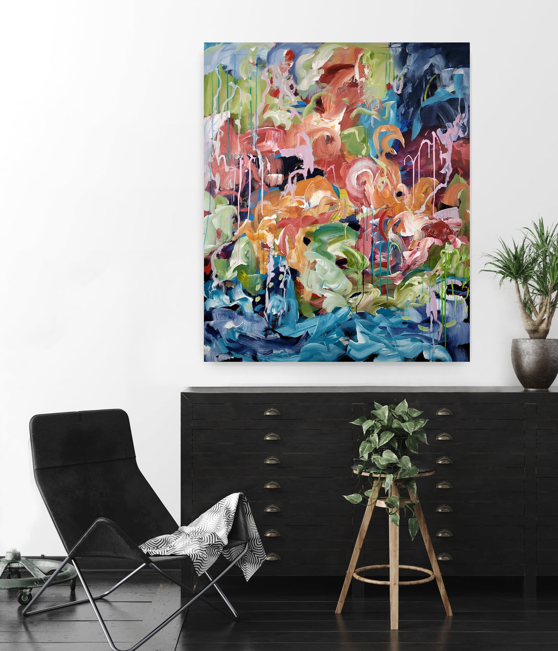 "Flamingo Paradise" by Marianne Nielsen brings colour and abstract art to this neutral interior space.
