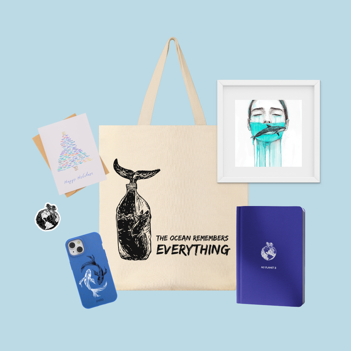 Collection of items including a tote bag with a whale design, a notebook, a phone case, a card, and a framed picture on a light blue background.